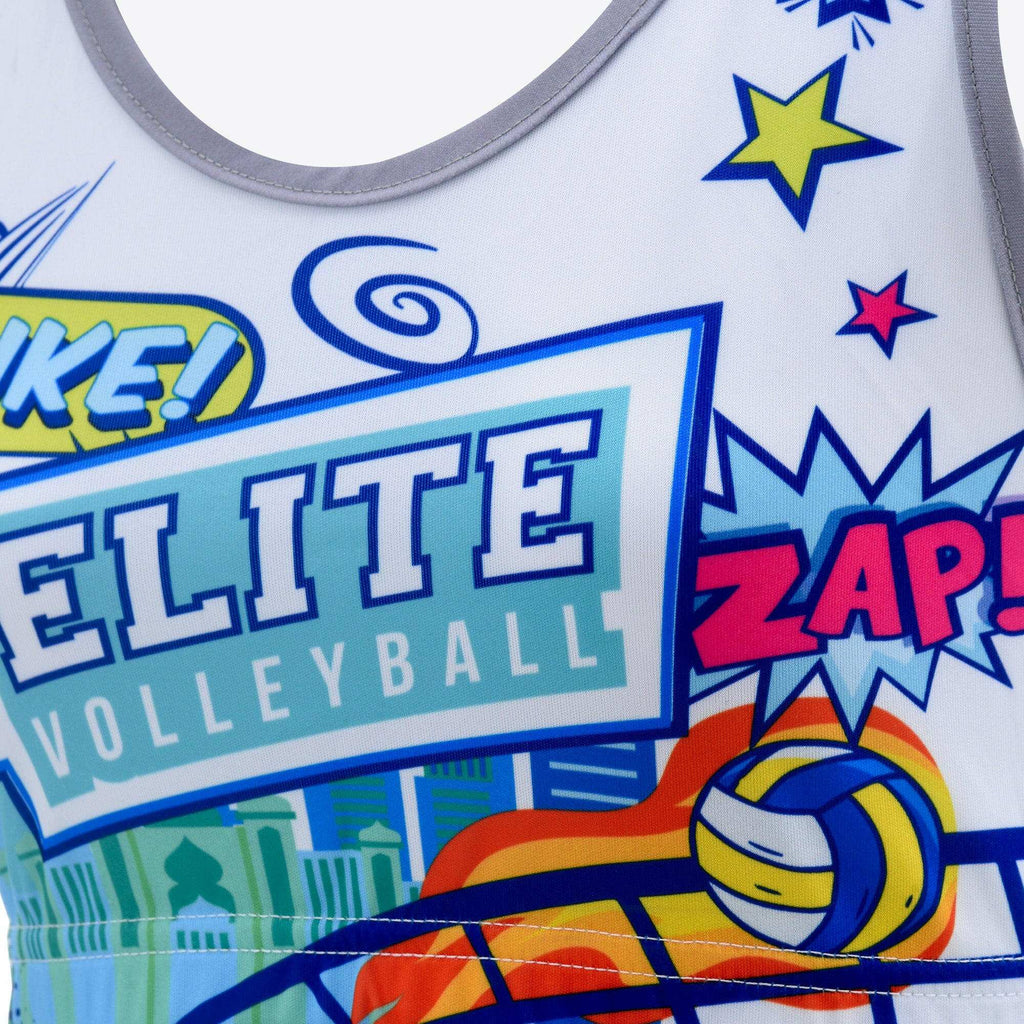 A cropped tank top with a colorful comic book style graphic that includes the text 'ELITE VOLLEYBALL' and various volleyball-themed graphics such as a volleyball and stars.